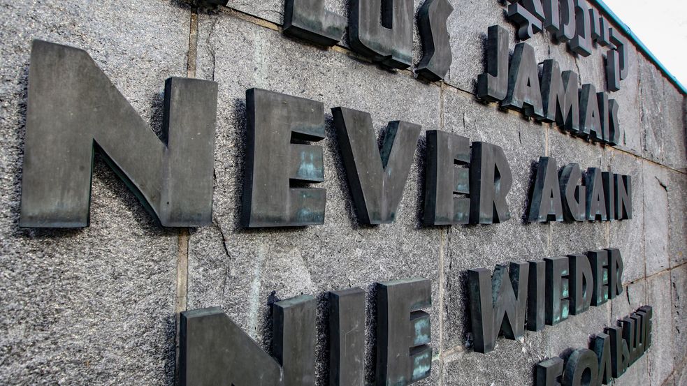 Photo of lettering "NEVER AGAIN" on international memorial at Concentration Camp Memorial Site Dachau. Photo: City of Dachau