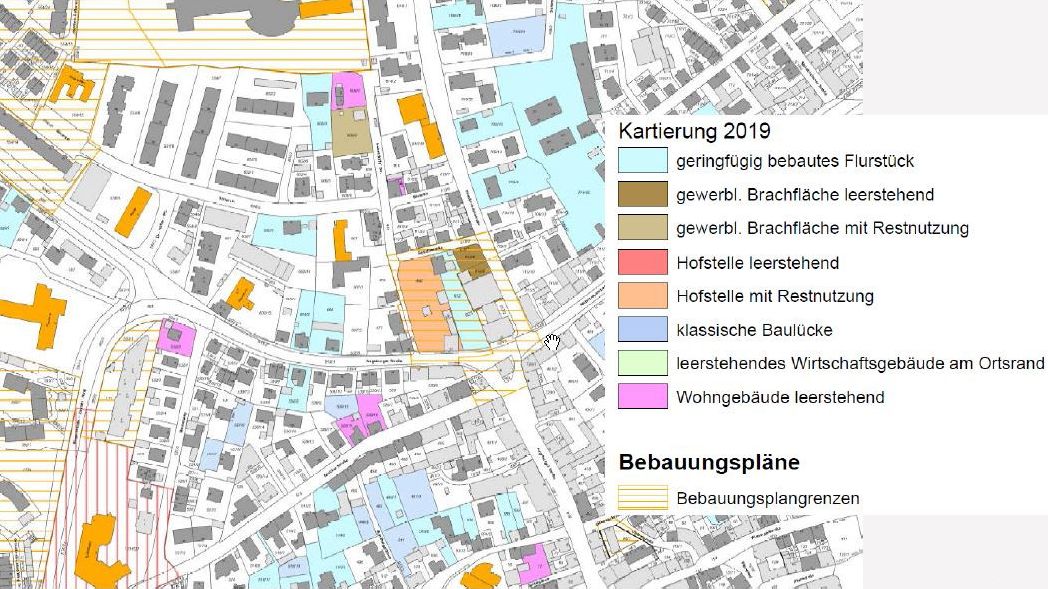 Abstrakter mehrfarbiger Stadtplan, der verschiedene Nutzungsarten von Gebäuden zeigt