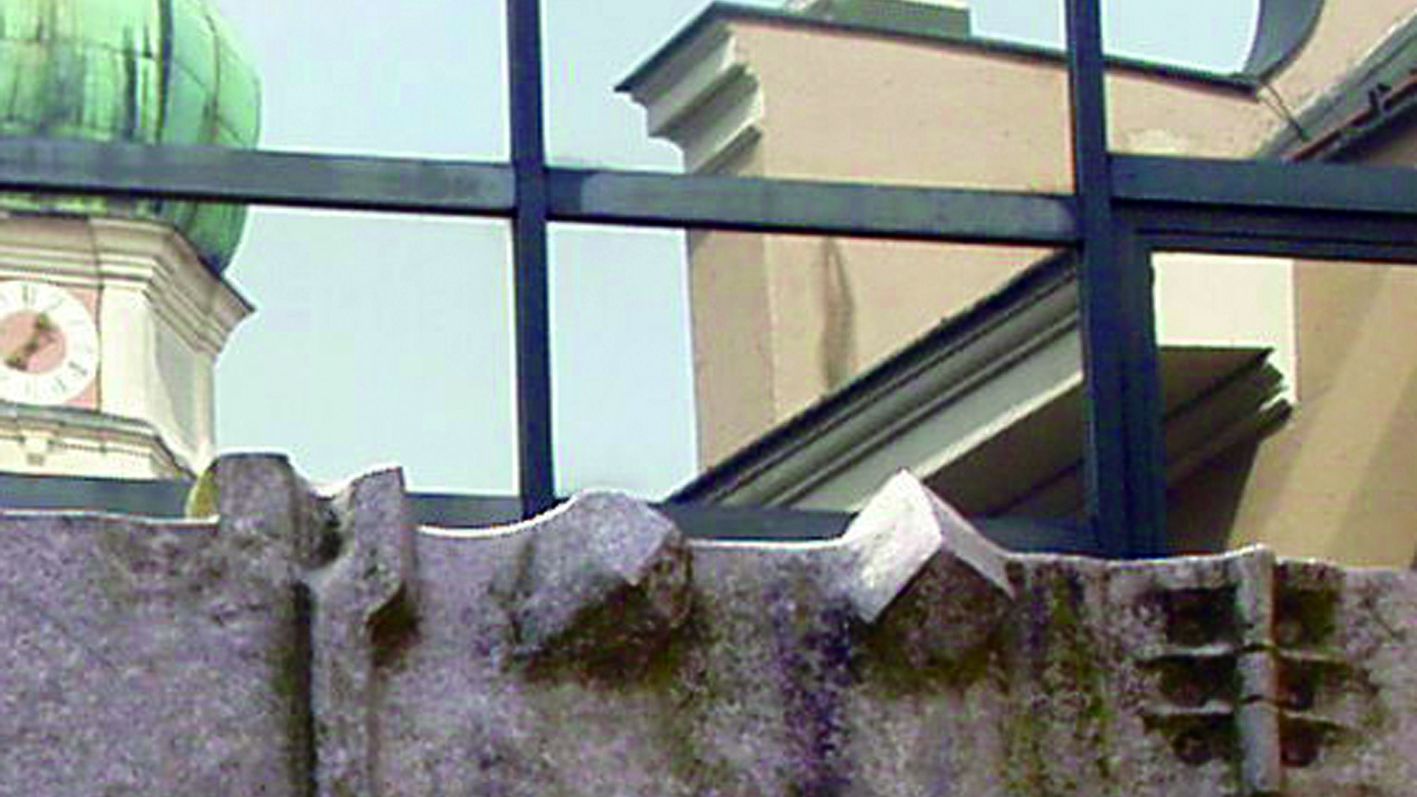 Balcony frieze at the Dachau town hall, the windows reflect the church of St. Jacob opposite.